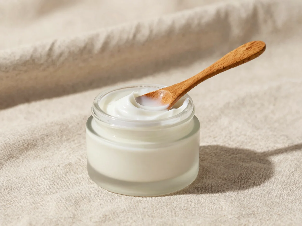 Clean botanical wellness photography, a small jar of face cream w